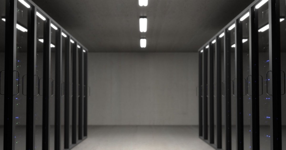 Rows of server racks in a data center, illustrating VPS, dedicated and cloud server hosting
